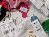 a lot of clothes and other items on a table