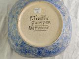 a blue and white bowl with writing on it
