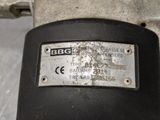 a close up of a metal plate on a motor bike