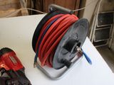 an image of a reel and a cording machine on a table