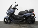 a picture of a motor scooter parked in a garage