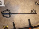 an image of a sword and a sword stand on the floor