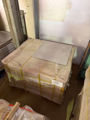 a lot of boxes and pallets in a room