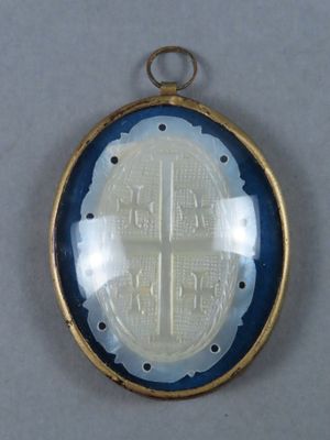 a picture of a gold and blue locke with a cross on it