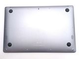 the back of a silver tablet computer sitting on top of a white surface