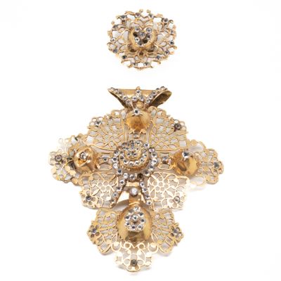 two pieces of gold colored brooches and a pair of earrings