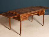 a small desk with a drawer on top of it