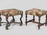 a pair of small stools with a floral upholstered seat