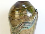 a glass vase with a wavy design on it