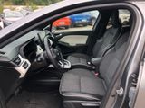 the interior of a car with the driver ' s seat folded down