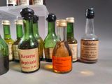 many bottles of alcohol sitting on a table
