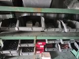 many bins of assorted items on a shelf