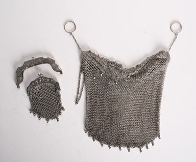 an image of a chain mail bag and a purse on a white surface