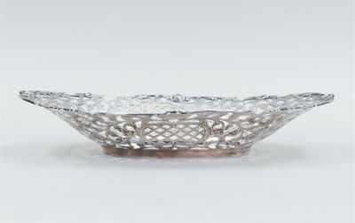 a silver plate with a flower design on it