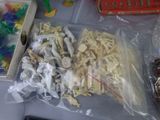 many different types of plastic toys on the table