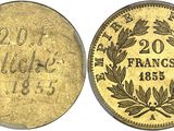 a close up of four gold coins on a white background