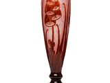 a glass vase with a design on it sitting on a table