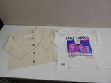 a white shirt and a white jacket on a table