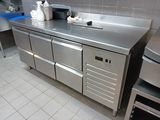 a stainless steel counter top in a commercial kitchen