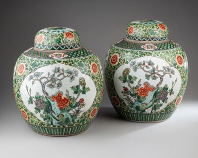 pair of chinese vases with flowers and birds on them