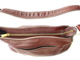 brown leather fanny bag on a white background with a zipper