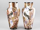 pair of vases decorated with birds and flowers on a gray background