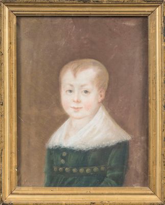 portrait of a young boy in a green dress