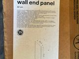 a cardboard box with a picture of a wall end panel in it
