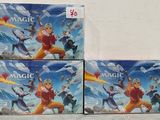 three boxes of magic the gathering board game on a white surface