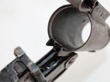 a close up of an old gun with a metal handle