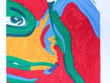 a picture of a painting of a woman ' s face on a piece of paper
