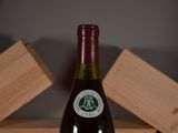 a bottle of wine that is sitting on a table