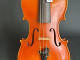 a close up of a violin with a bow on a black background