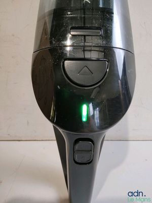 an image of a close up of a device with a green light