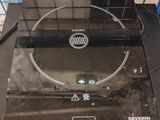 a black stove top with a black burner on top of it