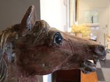 a statue of a horse that is standing in a room