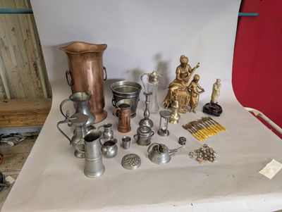 a table with a lot of silver objects on it