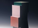 an image of a black and pink sculpture on a white surface
