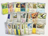 a lot of pokemon cards on the table together
