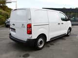 a white van that is parked in a parking lot