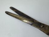 a close up of a pair of scissors on a table