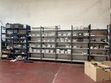 a large room with many shelves and bins on it