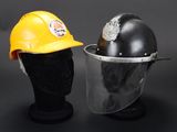 a close up of a helmet and a helmet on a mannequin head