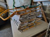a pile of tools sitting on top of a table in a garage