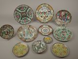 several plates and bowls are arranged in a circle on a table