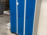 two blue lockers next to each other in a garage