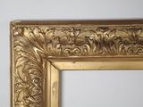 an image of a gold frame with a decorative design on it