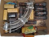 a box with a bunch of toy trains in it