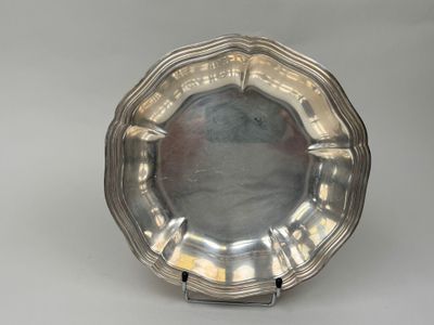 silver plate on stand on grey background with white background