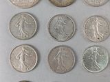 an image of a group of coins sitting on top of a white surface